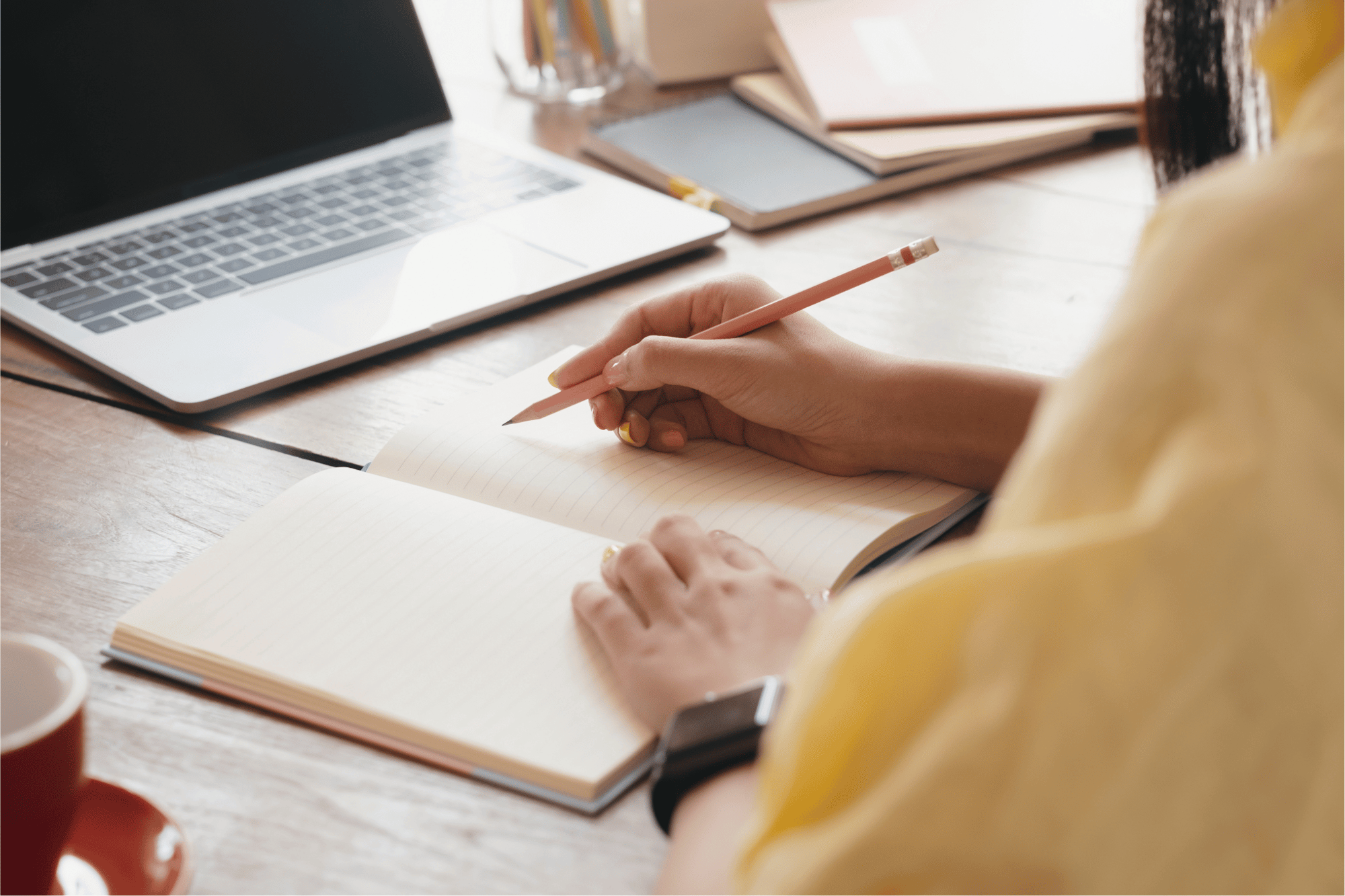 intercax user writing notes at desk